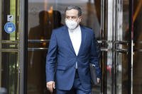 Political deputy at the Ministry of Foreign Affairs of Iran Abbas Araghchi leaves a hotel in Vienna.