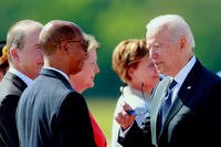 U.S. President Joe Biden, right, speaks with U.S. Ambassador Robert Wood, front left