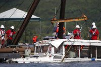 A duck boat that sank in Table Rock Lake in Branson, Missouri, is raised.