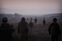 U.S. Marines and Afghan National Army soldiers walk in formation in Afghanistan.