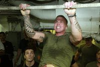 Marine takes part in pull-up challenge.