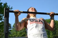 Pull-up is performed at Tough Mudder fitness challenge. 