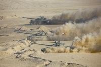 Tajikistan's tanks roll during a joint military drills by Russia and Uzbekistan
