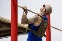 Marine performs pull-ups during Murph Challenge.