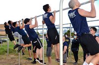 Sailors take a physical screening test.