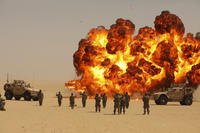 Soldiers participate in a mass reenlistment on an Explosive Ordnance Disposal Range at Camp Buehring, Kuwait.