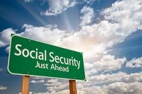 Highway sign reading &quot;Social Security Just Ahead&quot; signifying retirement incom