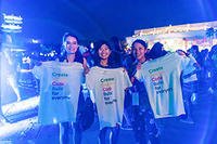 Three Google employees holding t-shirts celebrating diversity at Google