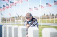 A veteran pauses for reflection at the Blackfoot Veterans Cemetery dedication. in Idaho.