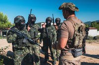 U.S. Army Green Beret assigned to 10th Special Forces Group prepares Albanian Special Forces soldiers