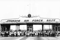 Family members pose at Spokane Air Force Base main gate circa 1950.