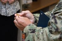 A Navy diver is promoted to the rank of master chief petty officer during a ceremony in Panama City, Florida.