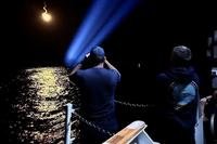 Coast Guard Cutter Escanaba crew members search for people in the water near Rodriguez Key, Florida.