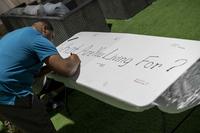 Airman writes message during a Suicide Prevention Month event.