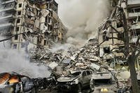 Smoke rises after a Russian rocket hit a multistory building.