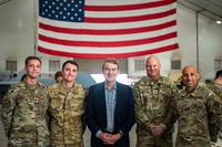 U.S. Sen. Michael Bennet of Colorado poses with U.S. Air Force airmen.