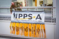 a banner in recognition of IPPS-A reaching live status in half of the ARNG's 54 states and territories