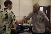 Christopher Sereno, the manager of the Marina and Outdoor Recreation and Equipment Center and Five-O Motors, meets a potential employee during a Marine Corps Community Services job fair aboard Marine Corps Base Hawaii, Aug. 17, 2017. (Lance Cpl. Autumn Rodenhizer/U.S. Marine Corps photo) Christopher Sereno, the manager of the Marina and Outdoor Recreation and Equipment Center and Five-O Motors, meets a potential employee during a Marine Corps Community Services job fair aboard Marine Corps Base Hawaii.