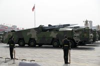 Vehicles carrying DF-17 ballistic missiles roll during a parade in Beijing. 