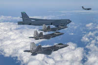 U.S. B-52 bomber, C-17, and U.S. Air Force F-22 fighter jets fly over the Korean Peninsula