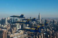 The U.S. Navy Flight Demonstration Squadron, the Blue Angels, pilots fly in the world-renowned Delta Formation past the New York skyline.