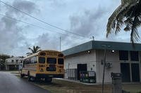 A school bus waits to transport residents in Guam, ahead of Typhoon Mawar.