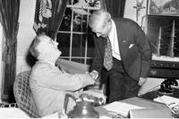 President Franklin D. Roosevelt greets William S. Knudsen, president of GM, when the latter arrived at the White House for the first meeting of the new National Defense Advisory Commission.
