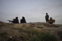 Taliban fighters gather in the late afternoon near Sakhi Shah-e Mardan Shrine in Kabul, Afghanistan