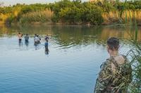 Texas Army National Guard patrol the banks of the Rio Grande