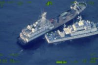 Chinese militia vessel, top, and Philippine coast guard vessel BRP Cabra