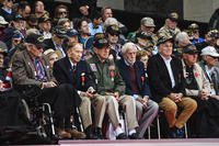 World War II veterans sit together after being awarded the French National Order of Merit from French President Emmanuel Macron at the 75th D-Day Anniversary ceremony at Normandy American Cemetery and Memorial in Colleville-sur-Mer, France