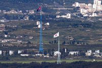 Flags of North Korea, rear, and South Korea, front, flutter in the wind as pictured from the border area between two Koreas in Paju, South Korea, on Aug. 9, 2021. (Im Byung-shik/Yonhap via AP, File) Flags of North Korea and South Korea seen from Paju, South Korea