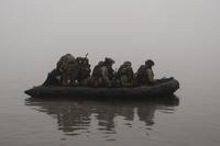Ukrainian marines sail along the Dnipro river at the frontline near Kherson, Ukraine