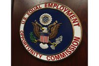 The emblem of the U.S. Equal Employment Opportunity Commission is shown on a podium in Vail, Colo.