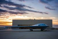 The B-21 Raider is designed with an open systems architecture, enabling rapid insertion of mature technologies and allowing the aircraft to be effective as threats evolve. (U.S. Air Force photo) The B-21 Raider at sunset.