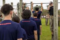 U.S. Marine recruits stand in line to do pullups