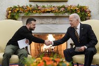 President Joe Biden shakes hands with Ukrainian President Volodymyr Zelenskyy as they meet in the Oval Office of the White House.