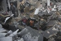 Palestinians look for survivors of the Israeli bombardment of the Gaza Strip