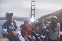 Family photo with the Golden Gate bridge in the background. 