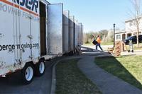 Movers load a moving van at Fort Knox