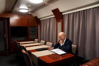 President Joe Biden sits on a train.