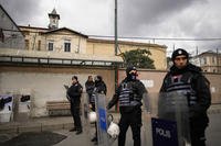 Turkish police officers stand guard outside the Santa Maria church in Istanbul, Turkey.
