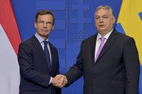 Sweden's Prime Minister Ulf Kristersson, left, shakes hands with his Hungarian counterpart Viktor Orban