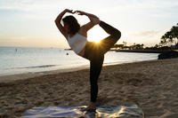 A1C Jayme Ratcliff, 324th Intelligence Squadron fusion analyst, practices yoga on Hickam Beach on Joint Base Pearl Harbor-Hickam, Hawaii.