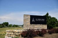 Signs greet personnel at the south entrance to Buckley Space Force Base in Aurora