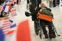 D-Day veteran Anthony Pagano arrives at Charles de Gaulle airport.