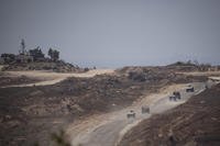 Israeli soldiers move near the Israeli-Gaza border