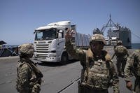 Humanitarian aid arrives at the U.S.-built floating pier Trident in Gaza