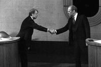 Jimmy Carter, left, and Gerald Ford, right, shake hands before the third presidential debate