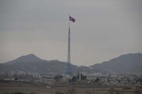 A North Korean flag flutters in North Korea's village Gijungdong